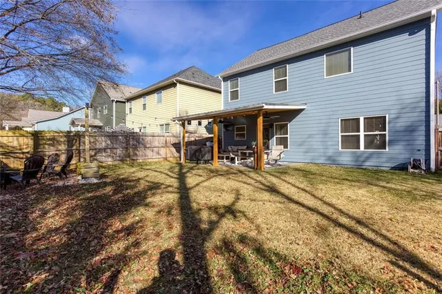 an aerial view of residential houses with outdoor space