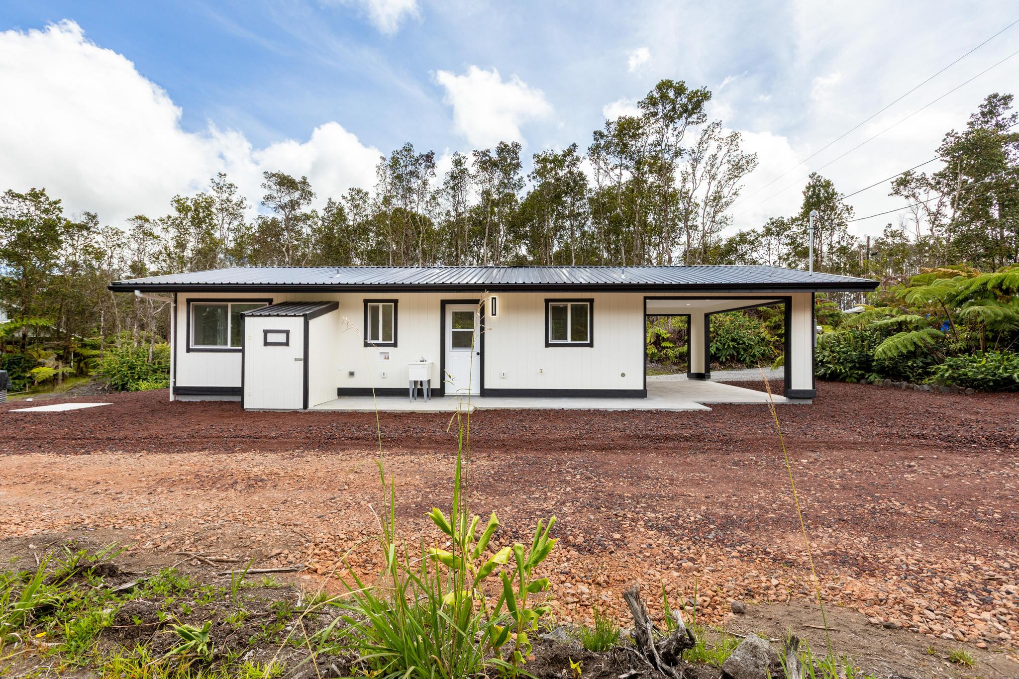 11-3116-a Mokuna Street Mountain View, HI 96771 - Photo 11 of 15 front view of a house with a garden