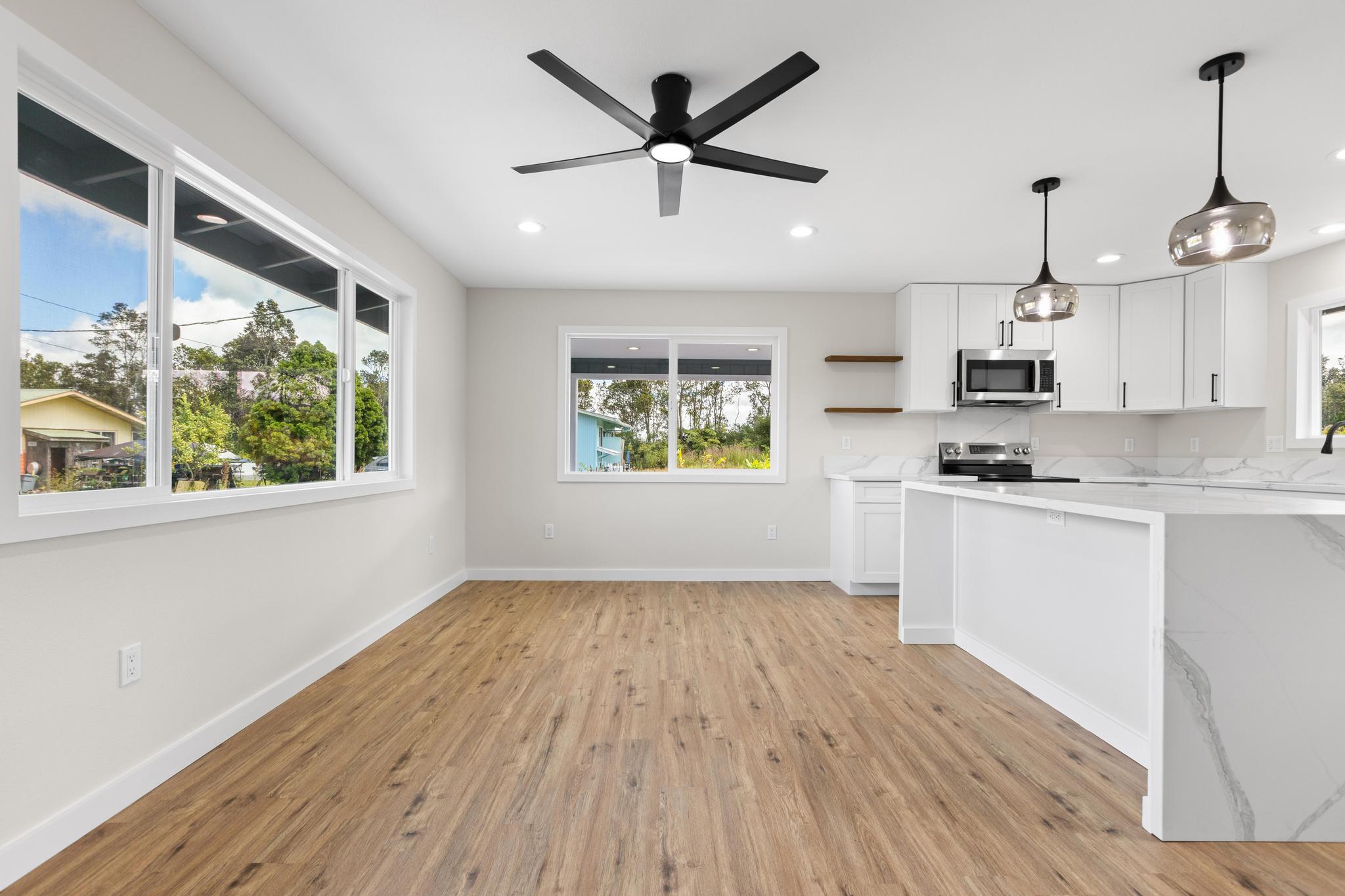 11-3116-a Mokuna Street Mountain View, HI 96771 - Photo 13 of 15 a view of an empty room with window and wooden floor