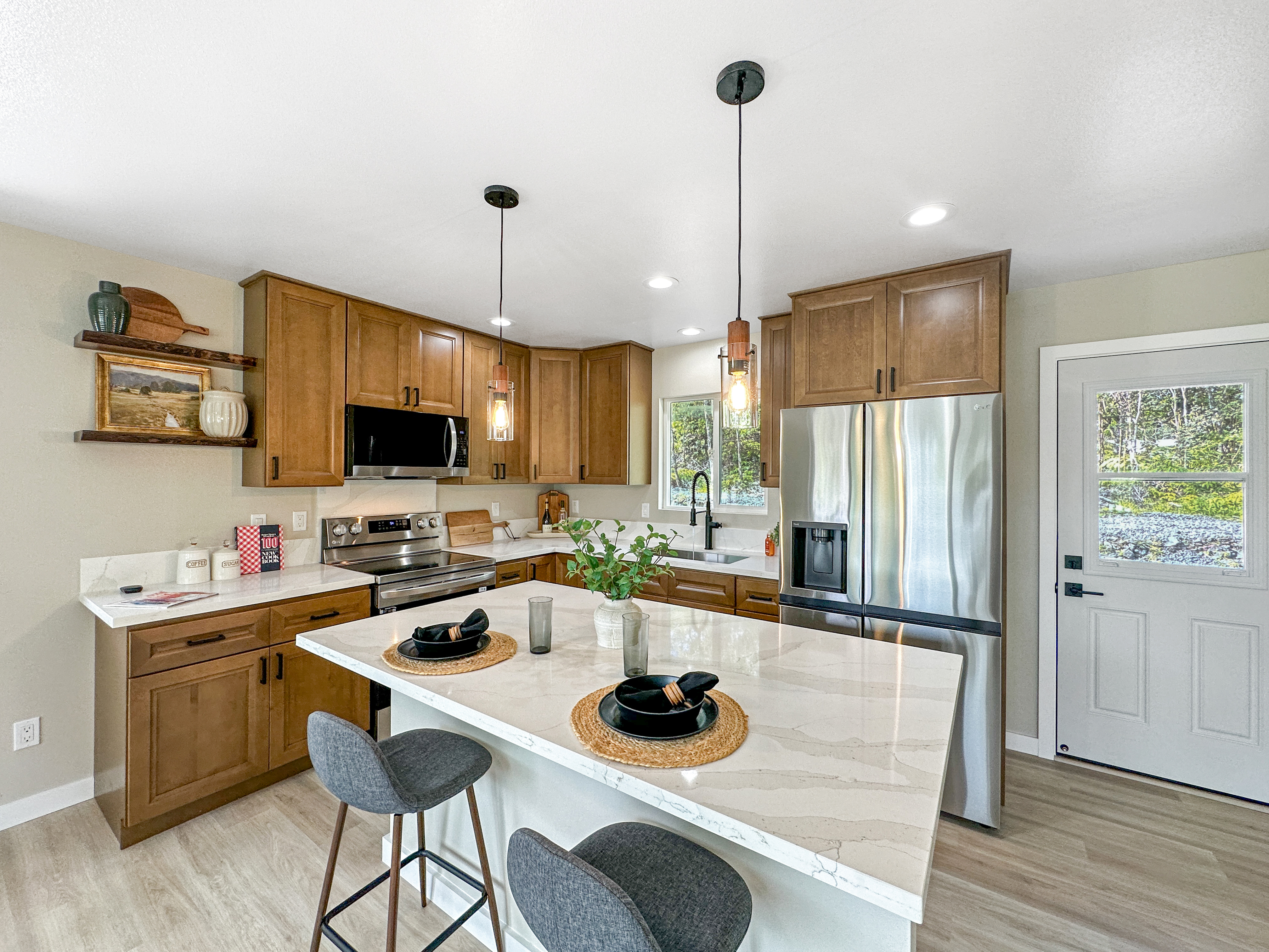 11-3116-a Mokuna Street Mountain View, HI 96771 - Photo 2 of 15 a kitchen with a sink a counter top space appliances and cabinets