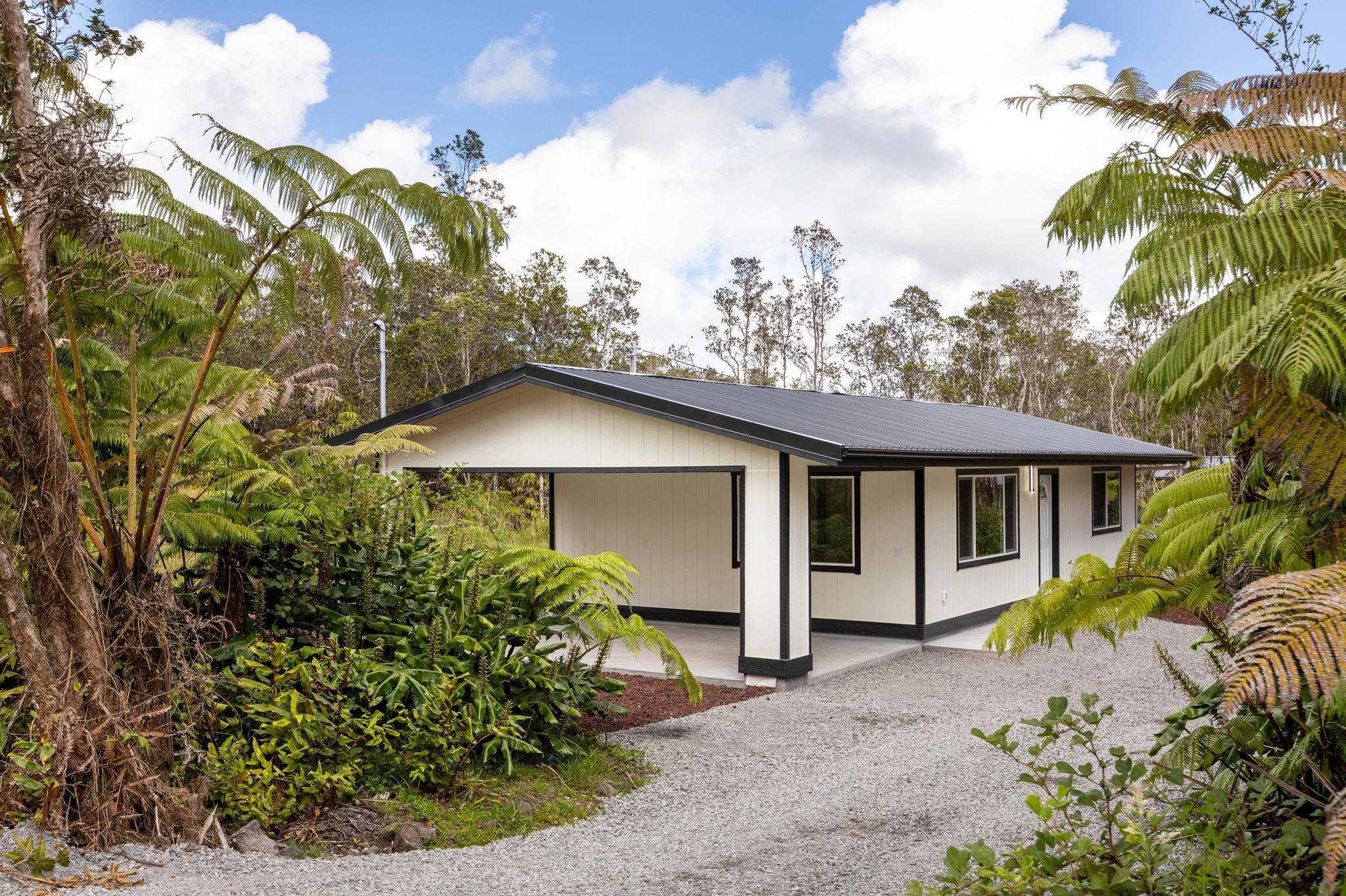 11-3116-a Mokuna Street Mountain View, HI 96771 - Photo 7 of 15 a front view of house with yard and trees around