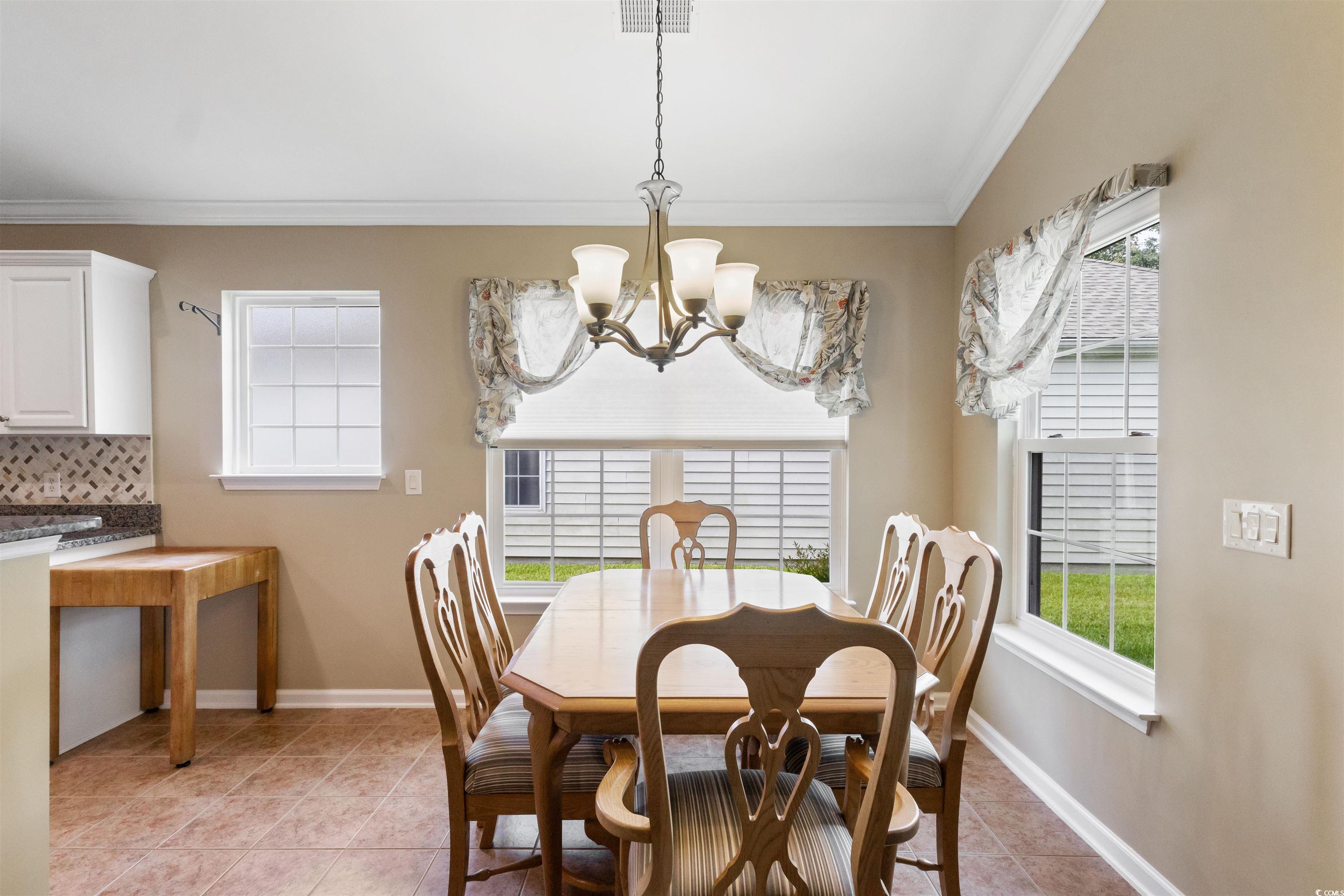 2210 Haystack Way Myrtle Beach, SC 29579 - Photo 11 of 33 Dining area featuring a chandelier, light tile pat