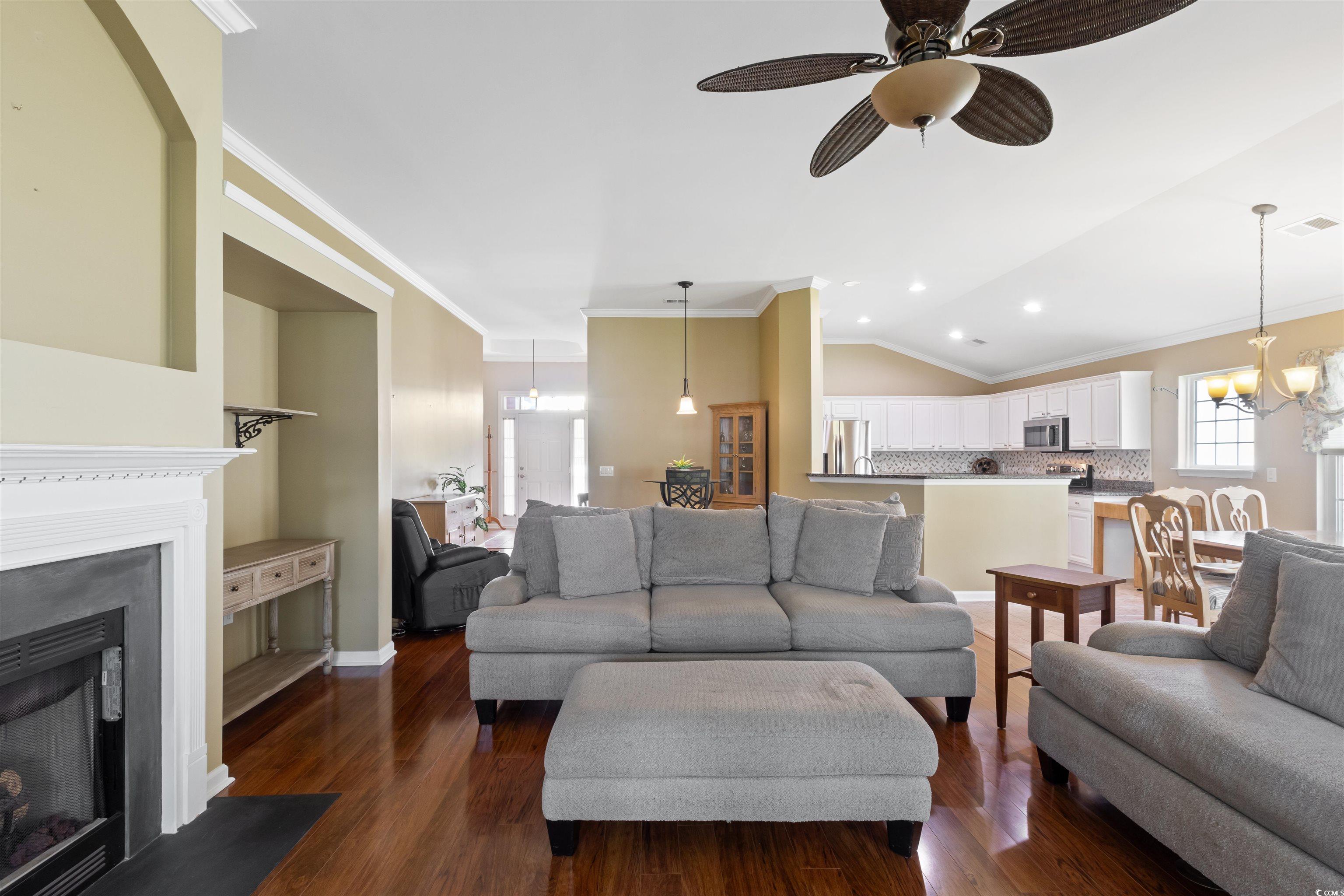 2210 Haystack Way Myrtle Beach, SC 29579 - Photo 10 of 33 Living room with ornamental molding, dark wood-typ