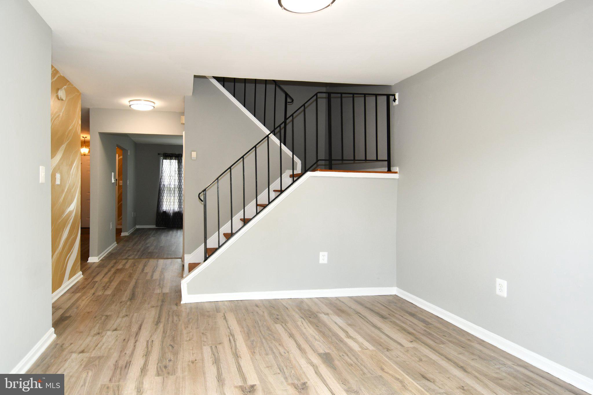 7737 Merrick Lane Landover, MD 20785 - Photo 16 of 34 Modern entryway with sleek staircase.