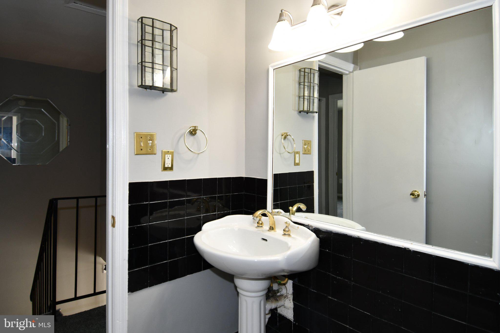7737 Merrick Lane Landover, MD 20785 - Photo 29 of 34 Elegant half-bath with modern accents.