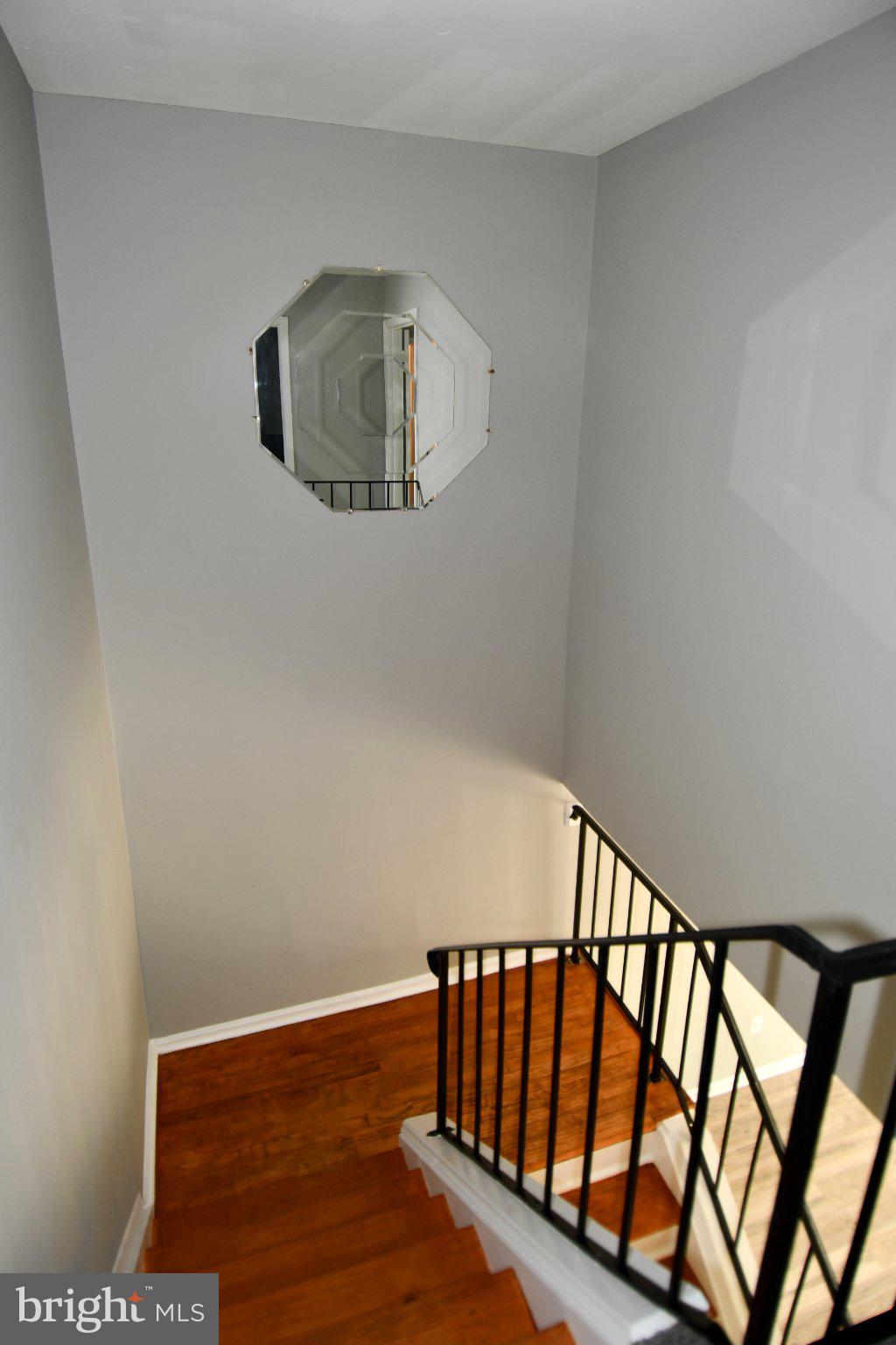 7737 Merrick Lane Landover, MD 20785 - Photo 30 of 34 Elegant staircase with unique mirror.