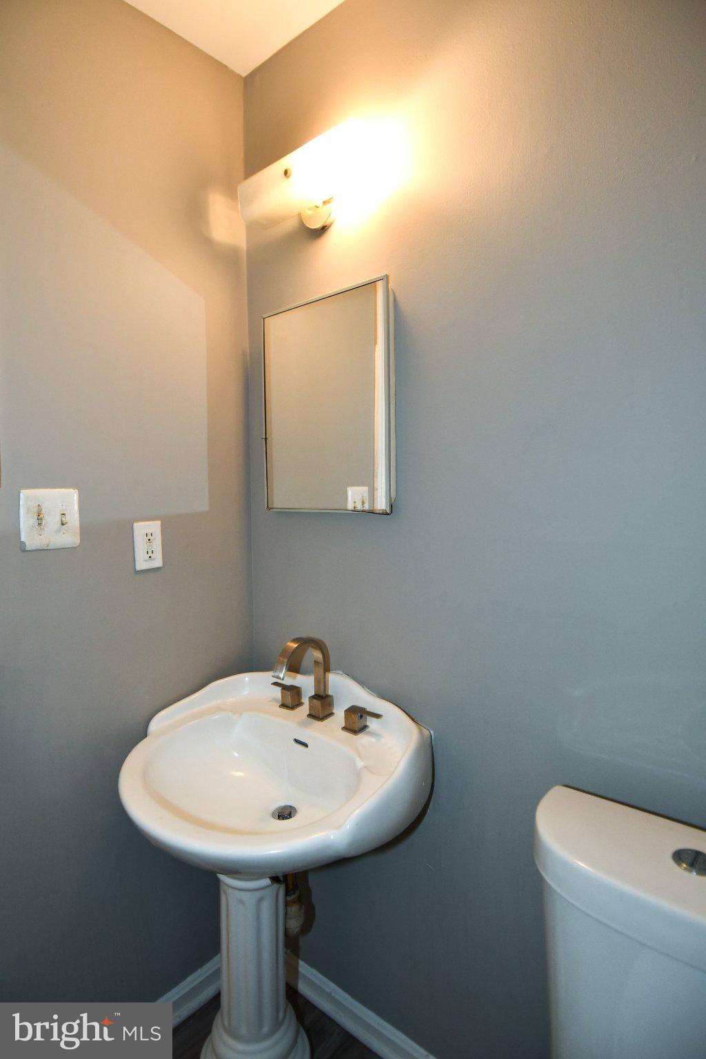 7737 Merrick Lane Landover, MD 20785 - Photo 9 of 34 Chic half-bath with modern elegance.
