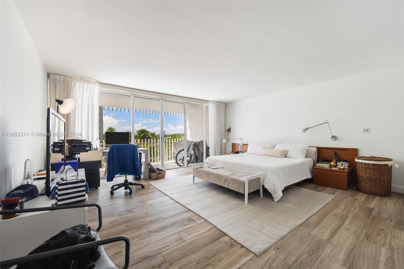 2 Grove Isle Drive, Unit B402 Miami, FL 33133 - Photo 11 of 35 a living room with furniture a rug and a window