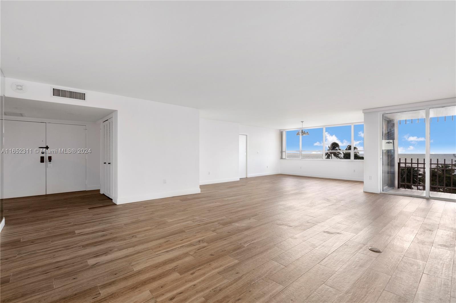 2 Grove Isle Drive, Unit B402 Miami, FL 33133 - Photo 13 of 35 a view of a kitchen with wooden floor