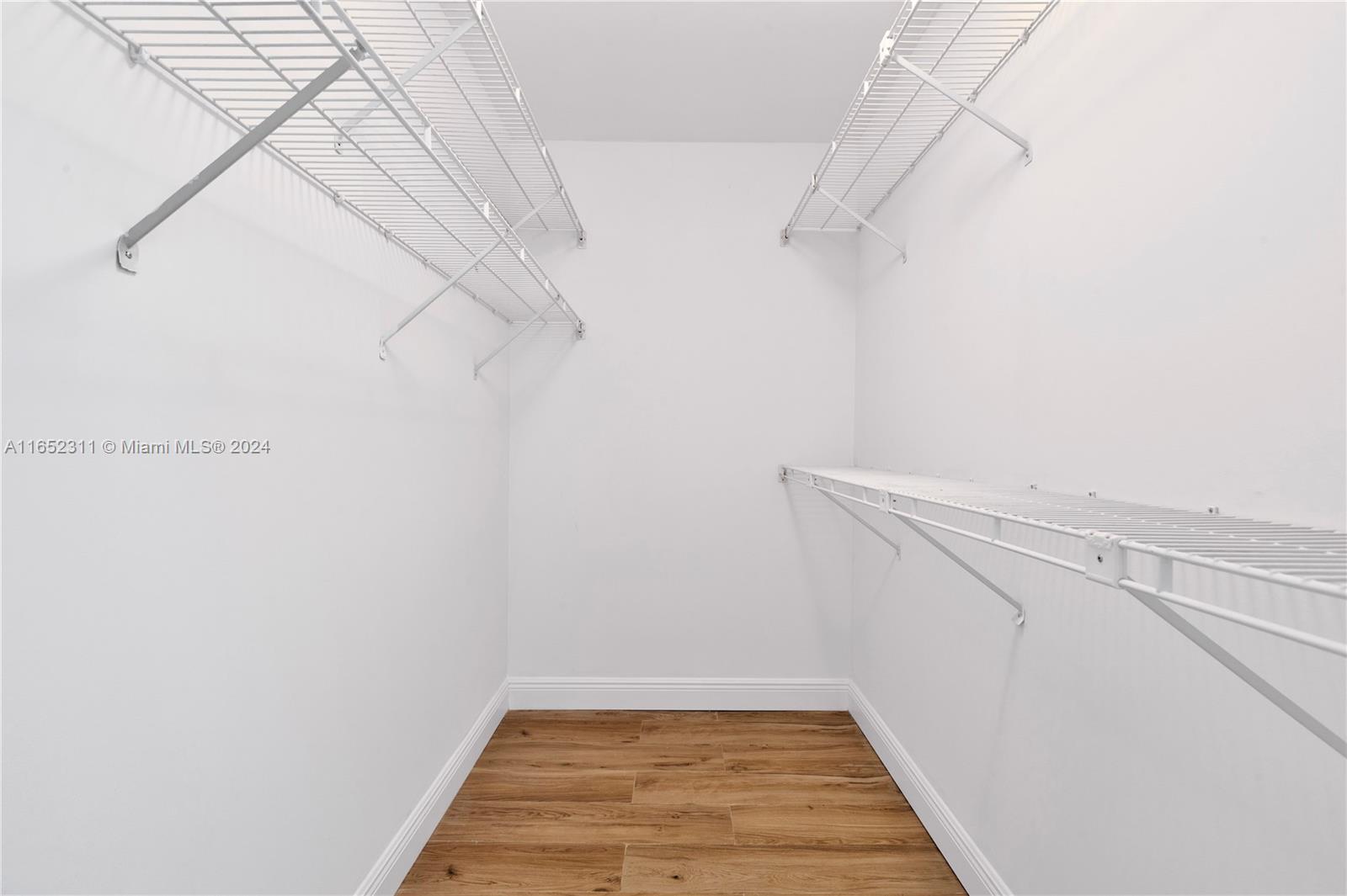 2 Grove Isle Drive, Unit B402 Miami, FL 33133 - Photo 19 of 35 a view of a room with racks on the wall