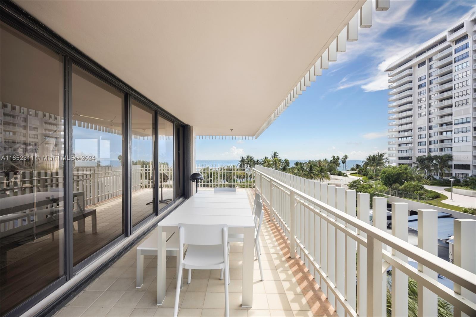 2 Grove Isle Drive, Unit B402 Miami, FL 33133 - Photo 31 of 35 a view of balcony with furniture