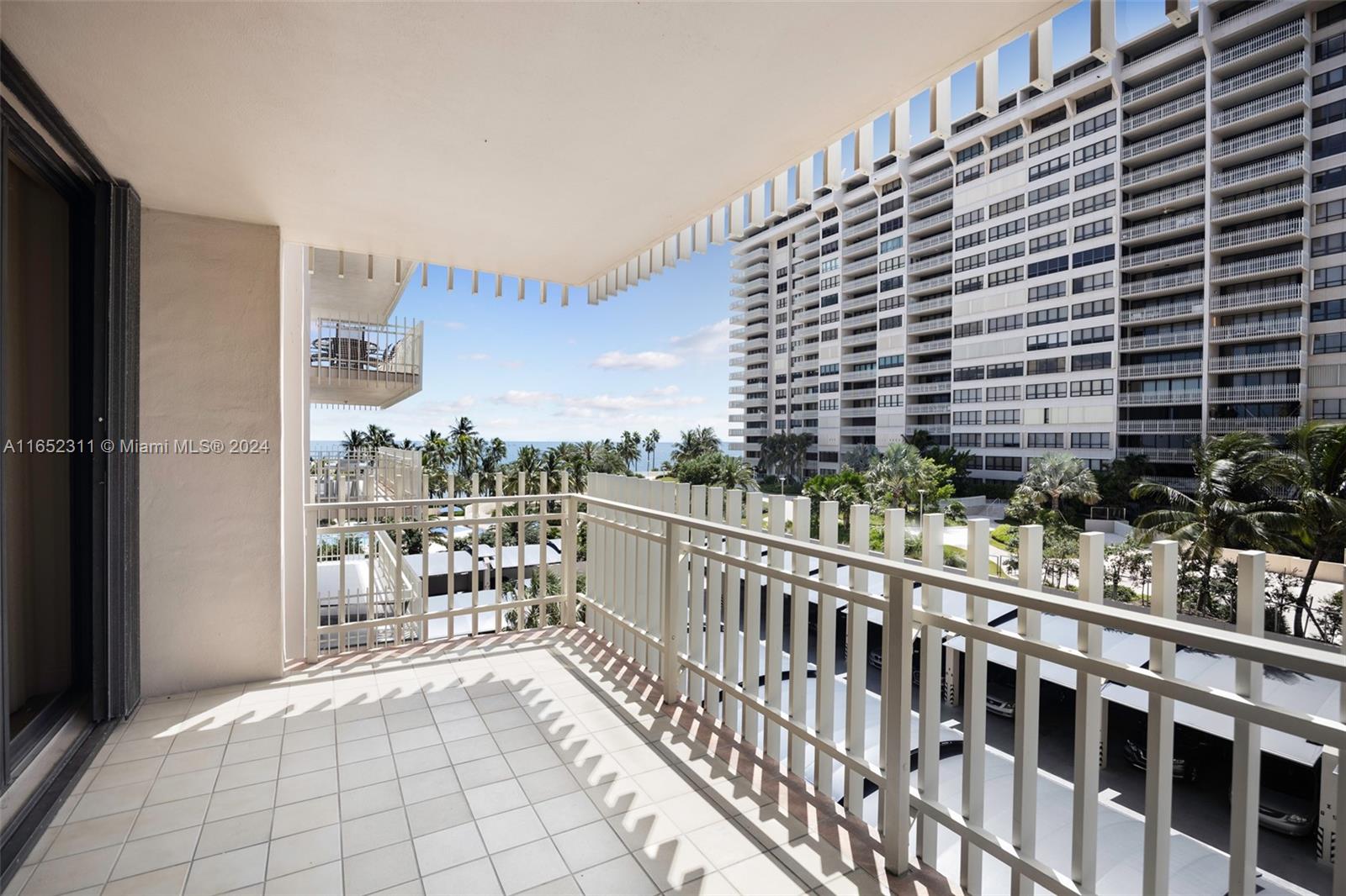 2 Grove Isle Drive, Unit B402 Miami, FL 33133 - Photo 33 of 35 a view of balcony with couch