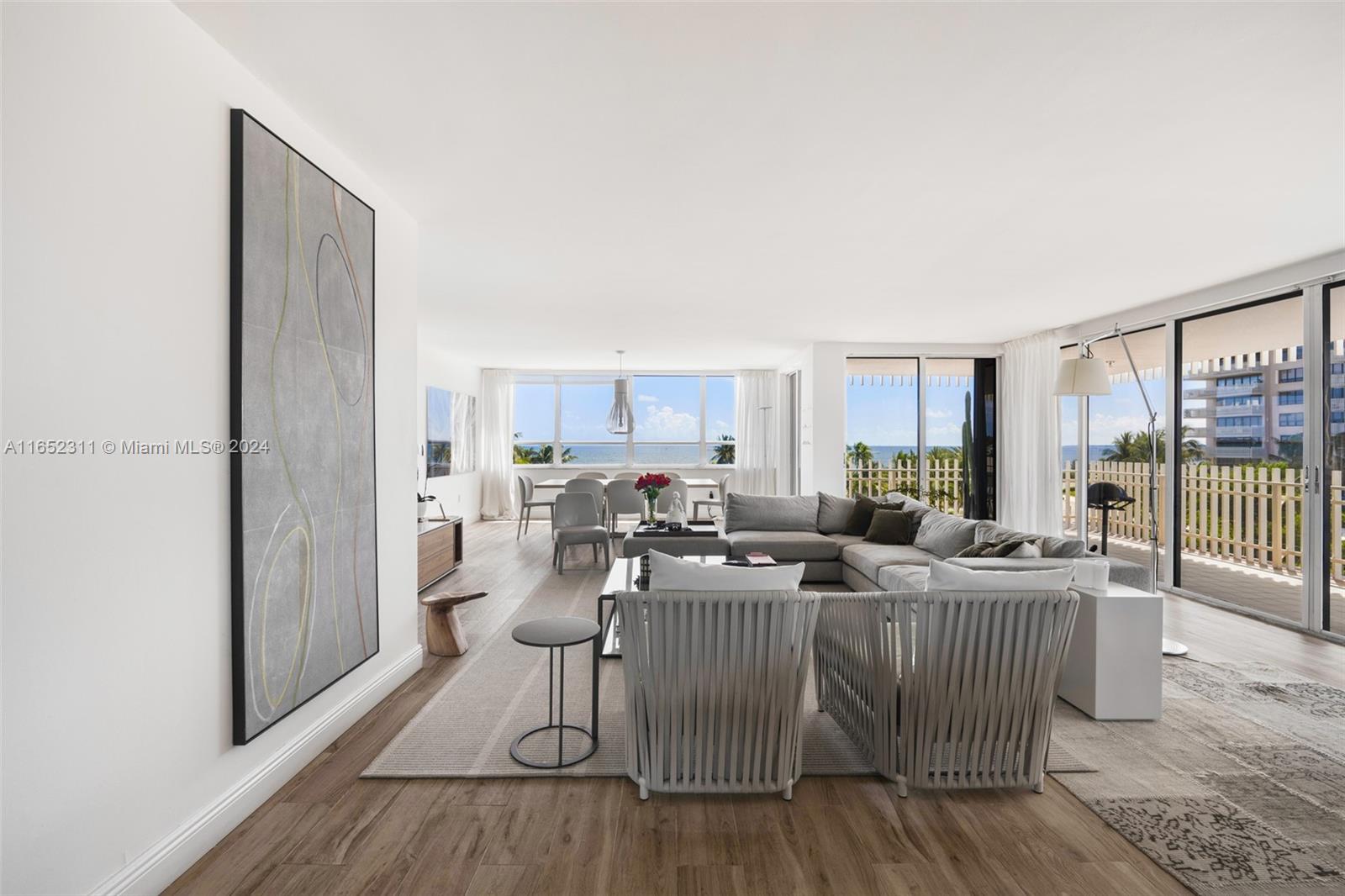 2 Grove Isle Drive, Unit B402 Miami, FL 33133 - Photo 4 of 35 a living room with furniture and a large window