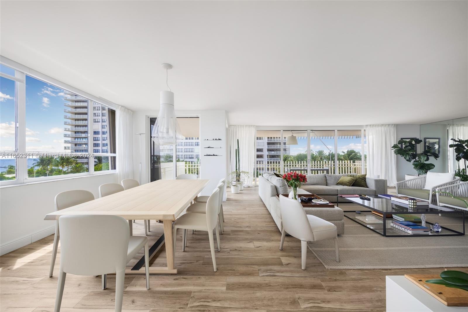 2 Grove Isle Drive, Unit B402 Miami, FL 33133 - Photo 6 of 35 a view of a dining room with furniture window and outside view