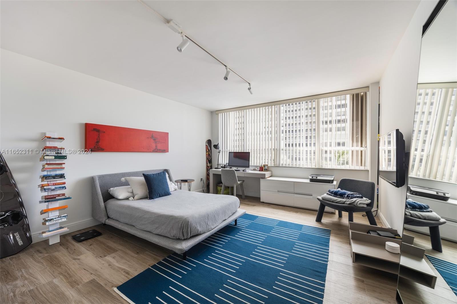 2 Grove Isle Drive, Unit B402 Miami, FL 33133 - Photo 10 of 35 a living room with furniture and a flat screen tv