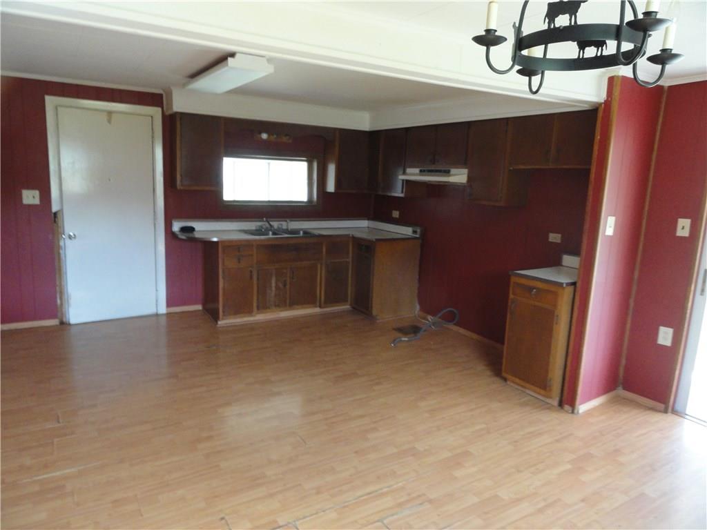 Country eat in kitchen with sliding door to back porch.