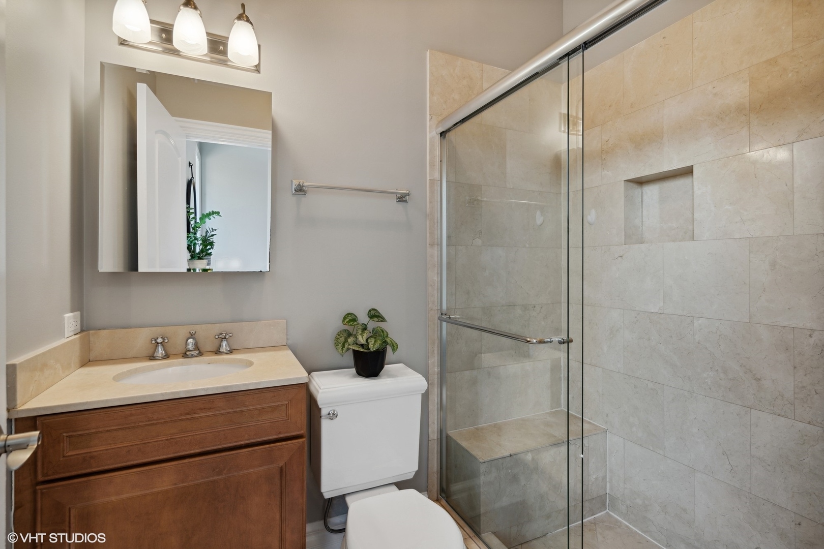 207 West St Paul Avenue, Unit 3W Chicago, IL 60614 - Photo 12 of 15 a bathroom with a sink toilet and shower