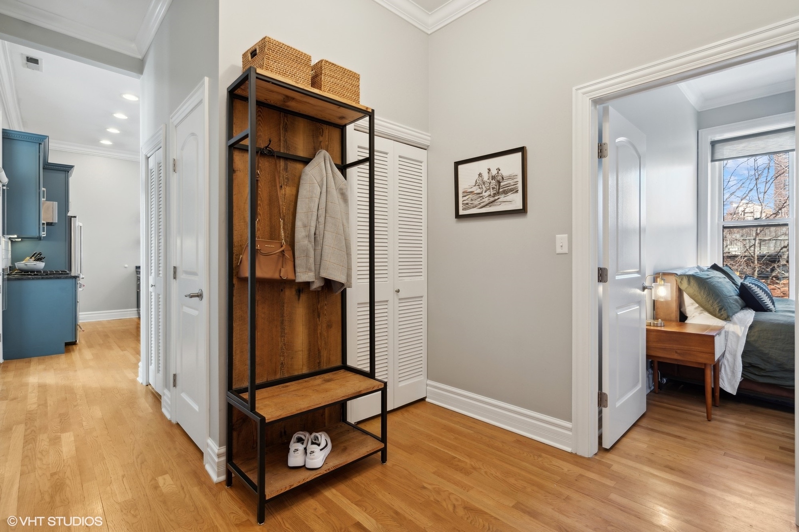 207 West St Paul Avenue, Unit 3W Chicago, IL 60614 - Photo 14 of 15 a room with furniture and a wooden floor