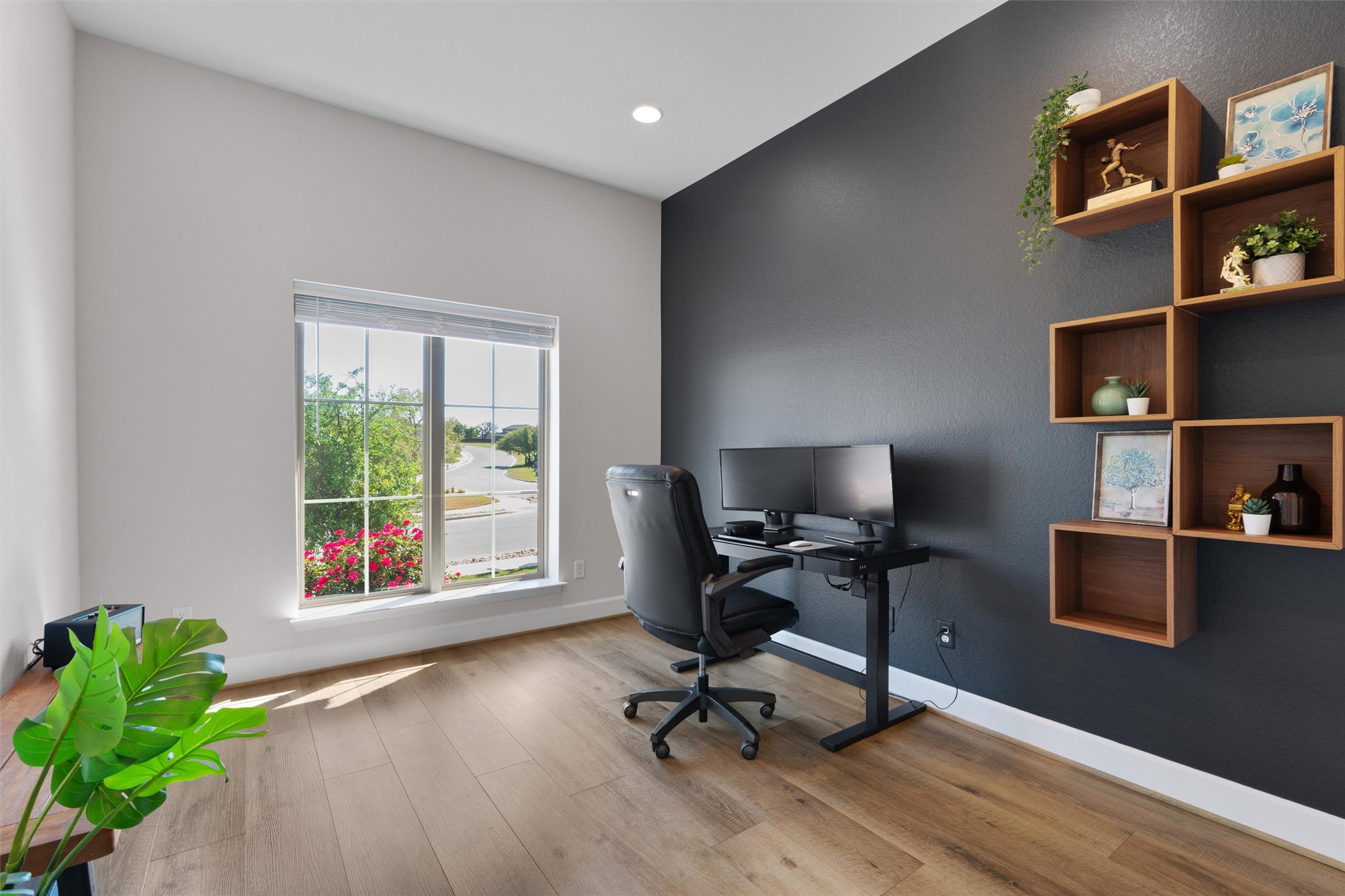 101 Pienza Drive Georgetown, TX 78628 - Photo 6 of 40 a view of a workspace with furniture and a window