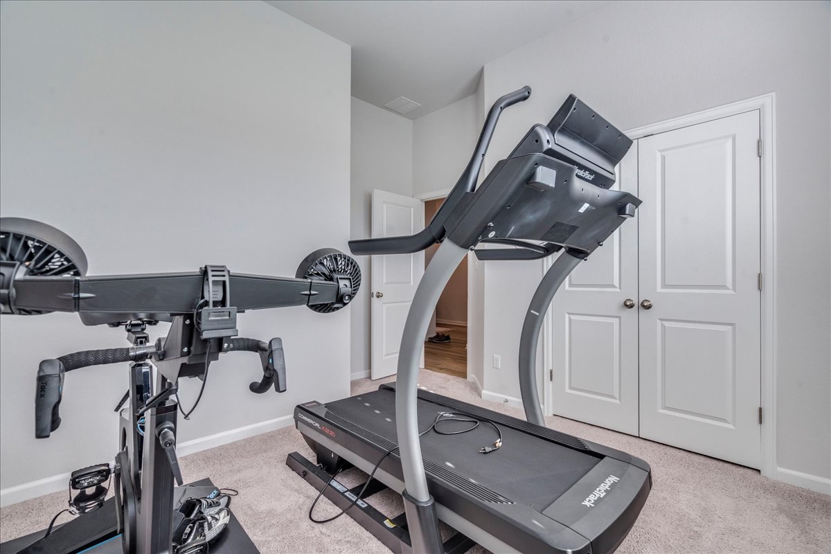 200 Christi Court Kyle, TX 78640 - Photo 25 of 40 Workout area featuring light carpet