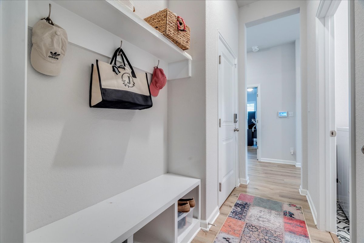 200 Christi Court Kyle, TX 78640 - Photo 29 of 40 Mudroom with light wood finished floors and baseboards