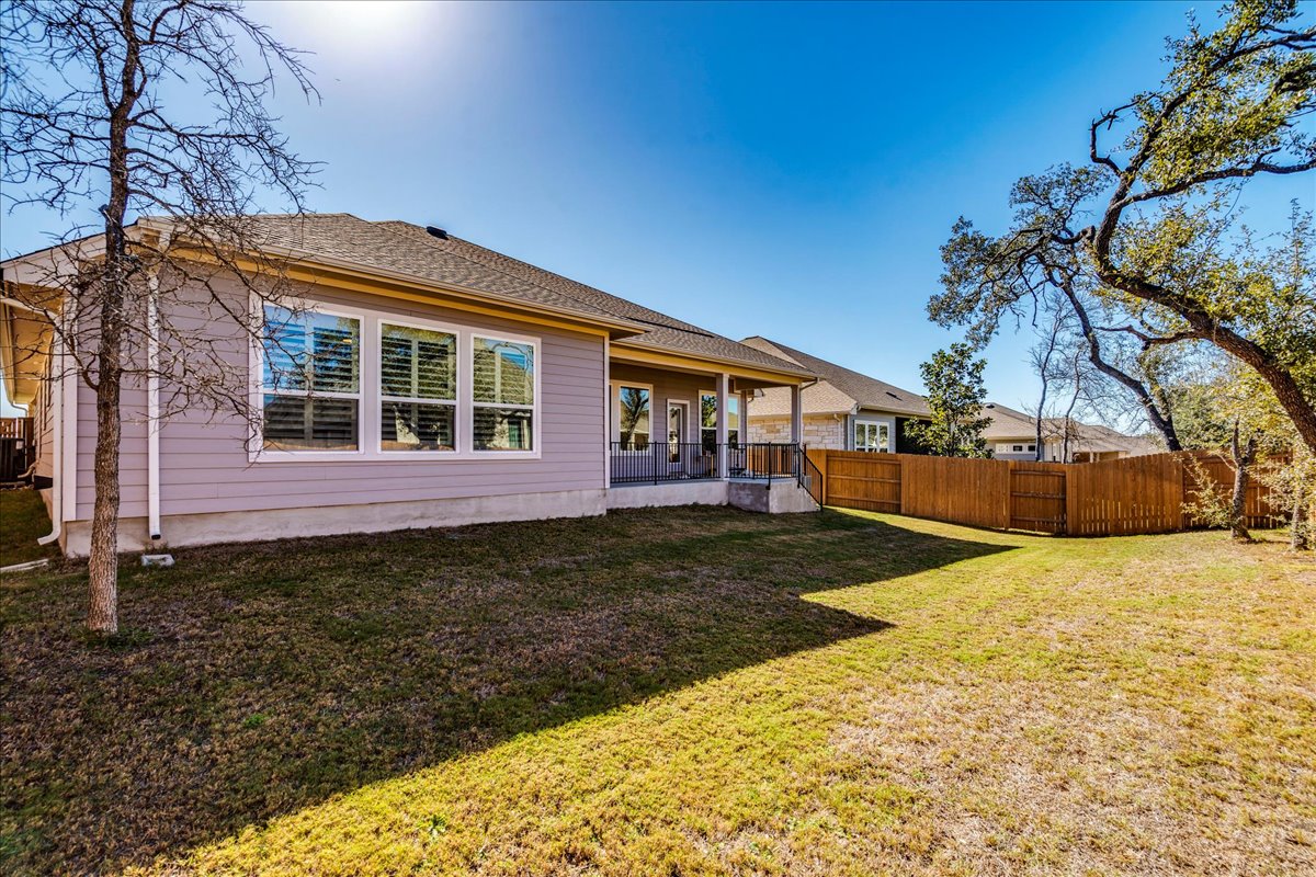 200 Christi Court Kyle, TX 78640 - Photo 35 of 40 Rear view of house featuring a patio area and roof with shingles