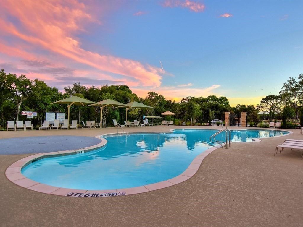 200 Christi Court Kyle, TX 78640 - Photo 36 of 40 Pool at dusk featuring a patio area and a community pool