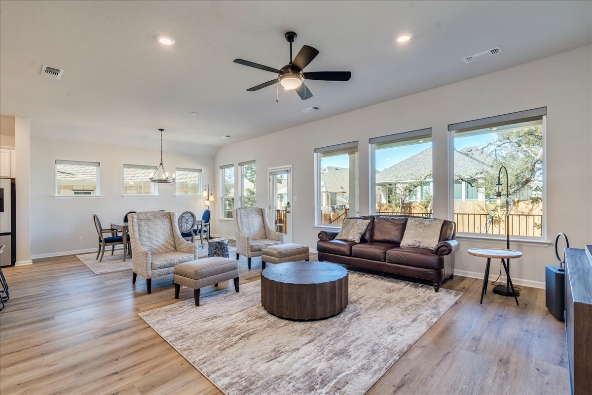 200 Christi Court Kyle, TX 78640 - Photo 5 of 40 Living room with light wood-style flooring, a ceiling fan, and recessed lighting