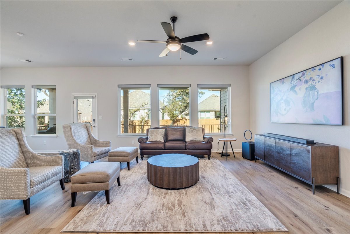 200 Christi Court Kyle, TX 78640 - Photo 7 of 40 Living area with light wood-type flooring, ceiling fan, and recessed lighting