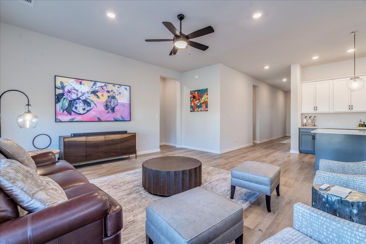 200 Christi Court Kyle, TX 78640 - Photo 10 of 40 Living room featuring light wood-style flooring, ceiling fan, and recessed lighting