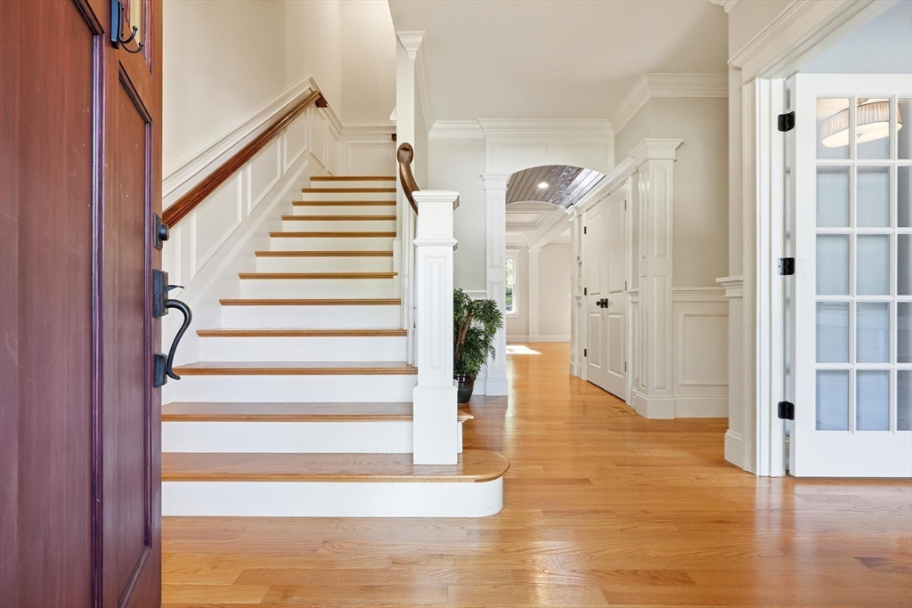 6 Flintlock Road Lexington, MA 02420 - Photo 19 of 39 a view of entryway with wooden floor and staircase