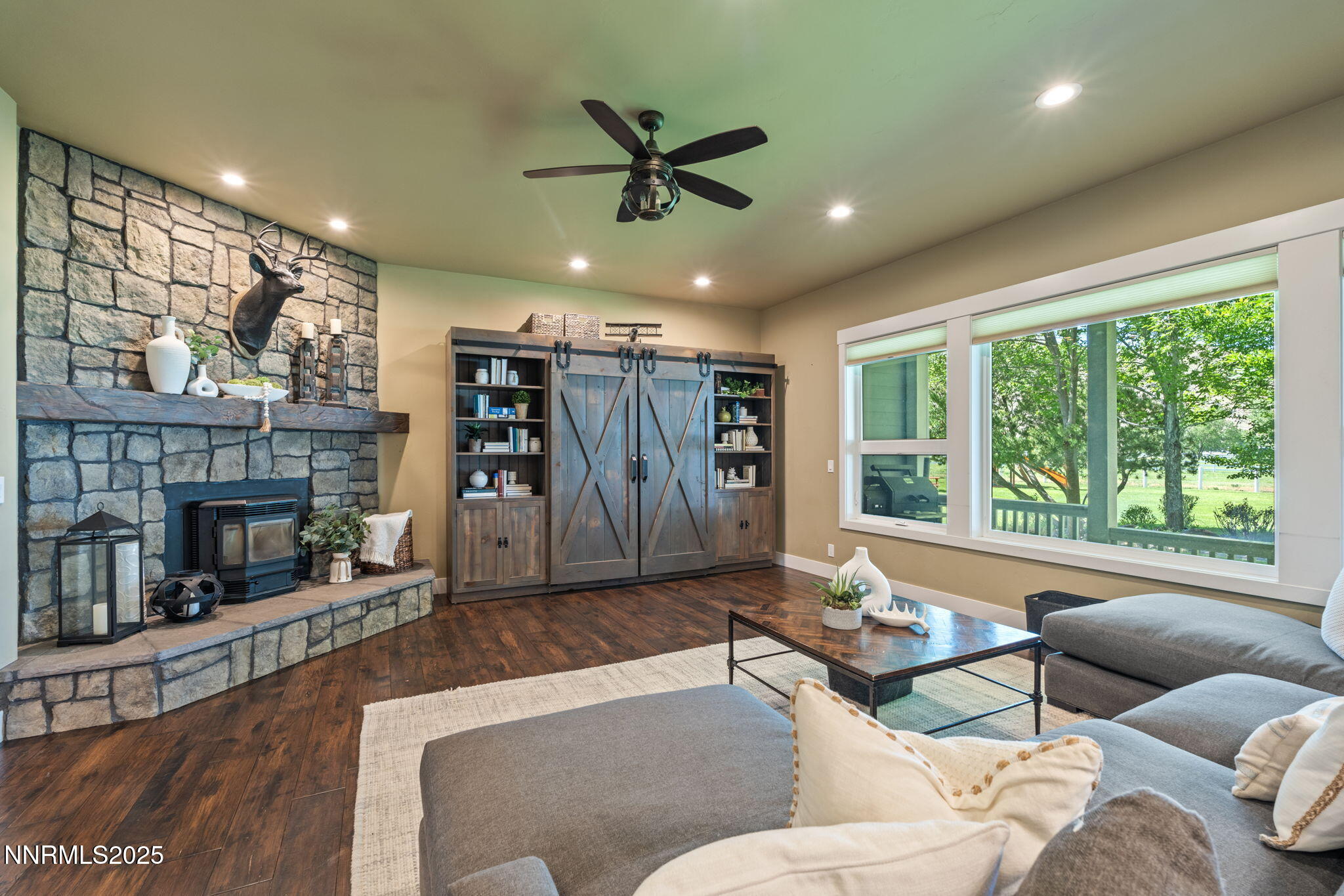 1020 North Cantlon Lane Reno, NV 89521 - Photo 11 of 28 a living room with furniture and a fireplace