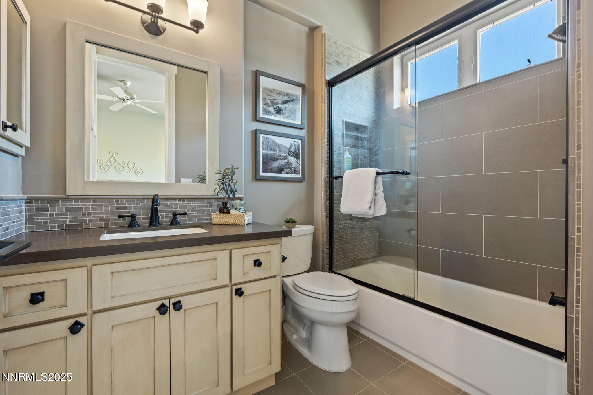 1020 North Cantlon Lane Reno, NV 89521 - Photo 21 of 28 a bathroom with a sink a toilet and shower