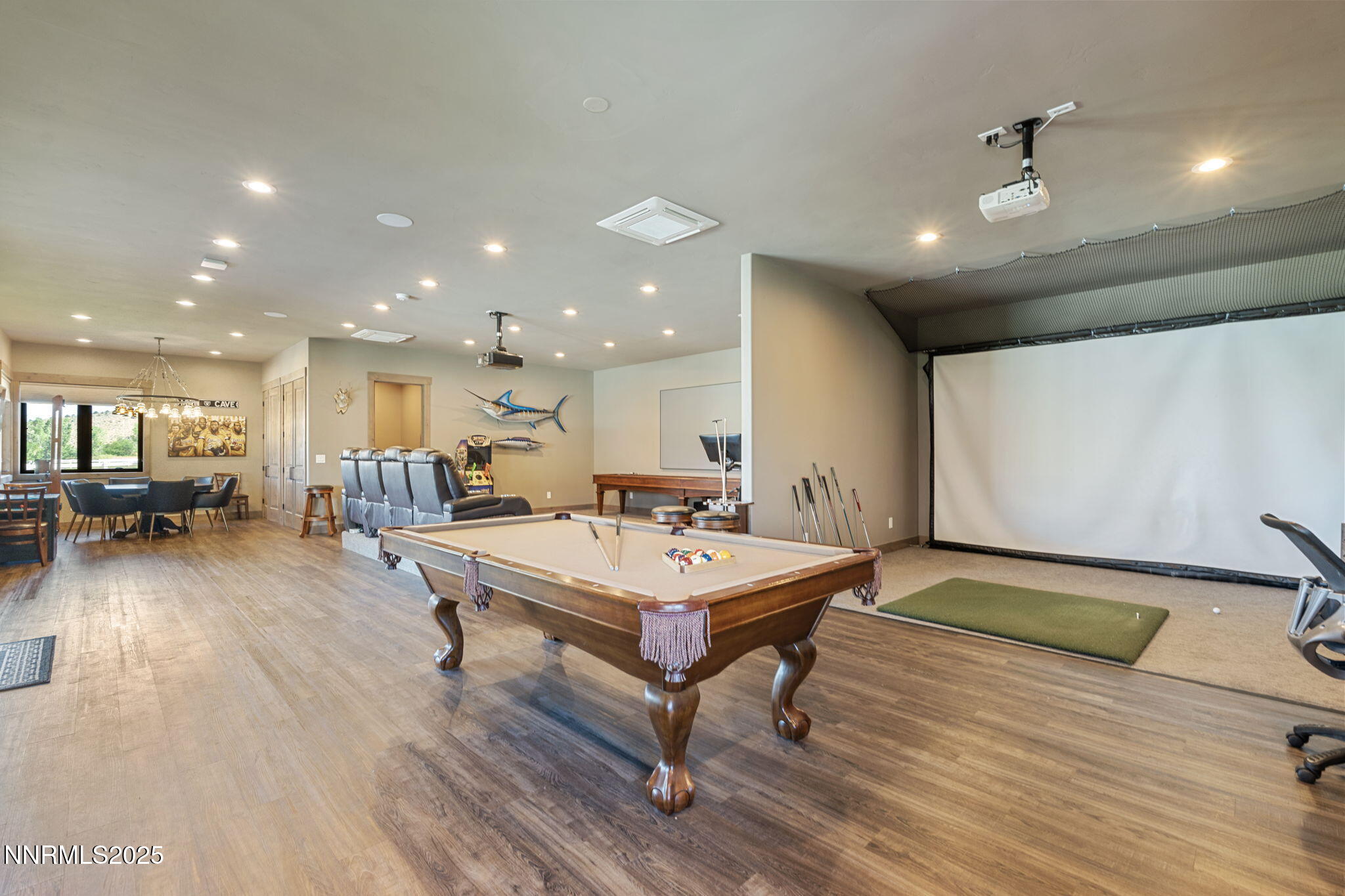 1020 North Cantlon Lane Reno, NV 89521 - Photo 23 of 28 a living room with furniture a table and kitchen view