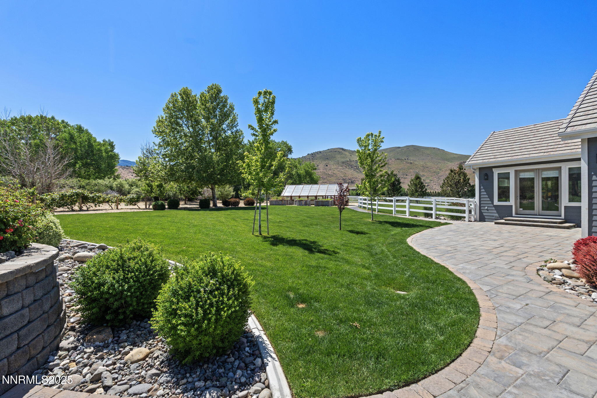 1020 North Cantlon Lane Reno, NV 89521 - Photo 25 of 28 a view of a house with a backyard porch and sitting area