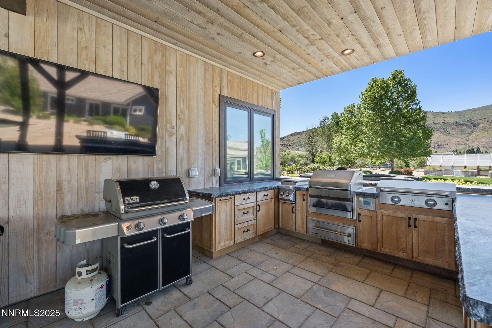 1020 North Cantlon Lane Reno, NV 89521 - Photo 27 of 28 a kitchen with sink stove and cabinets