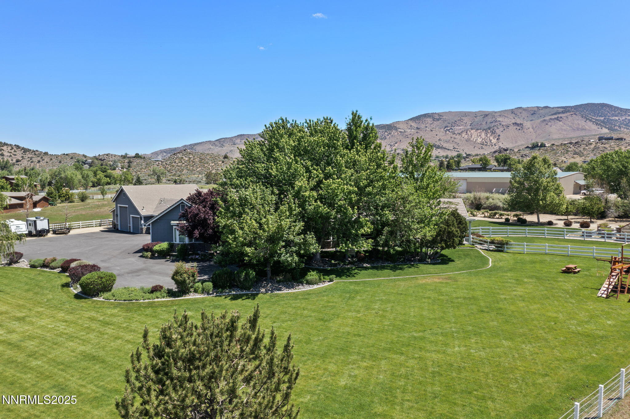 1020 North Cantlon Lane Reno, NV 89521 - Photo 5 of 28 a view of a garden with a building in the background
