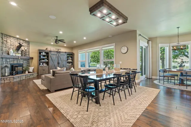 a view of a dining room with furniture window and wooden floor