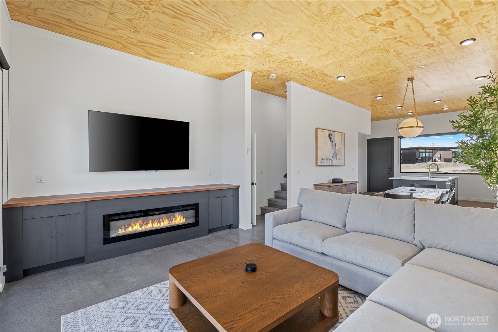 202 Rattlesnake Pt Road Northwest Quincy, WA 98848 - Photo 18 of 37 a living room with furniture and a flat screen tv