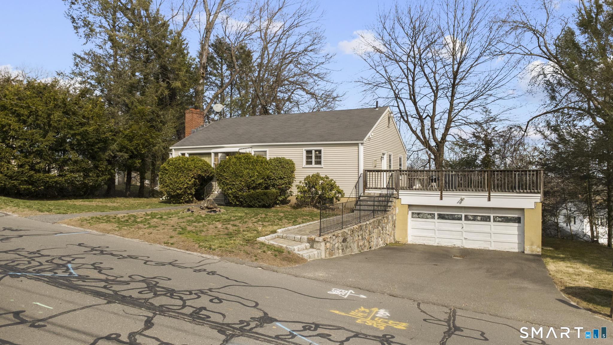 a view of a house with a yard and garage