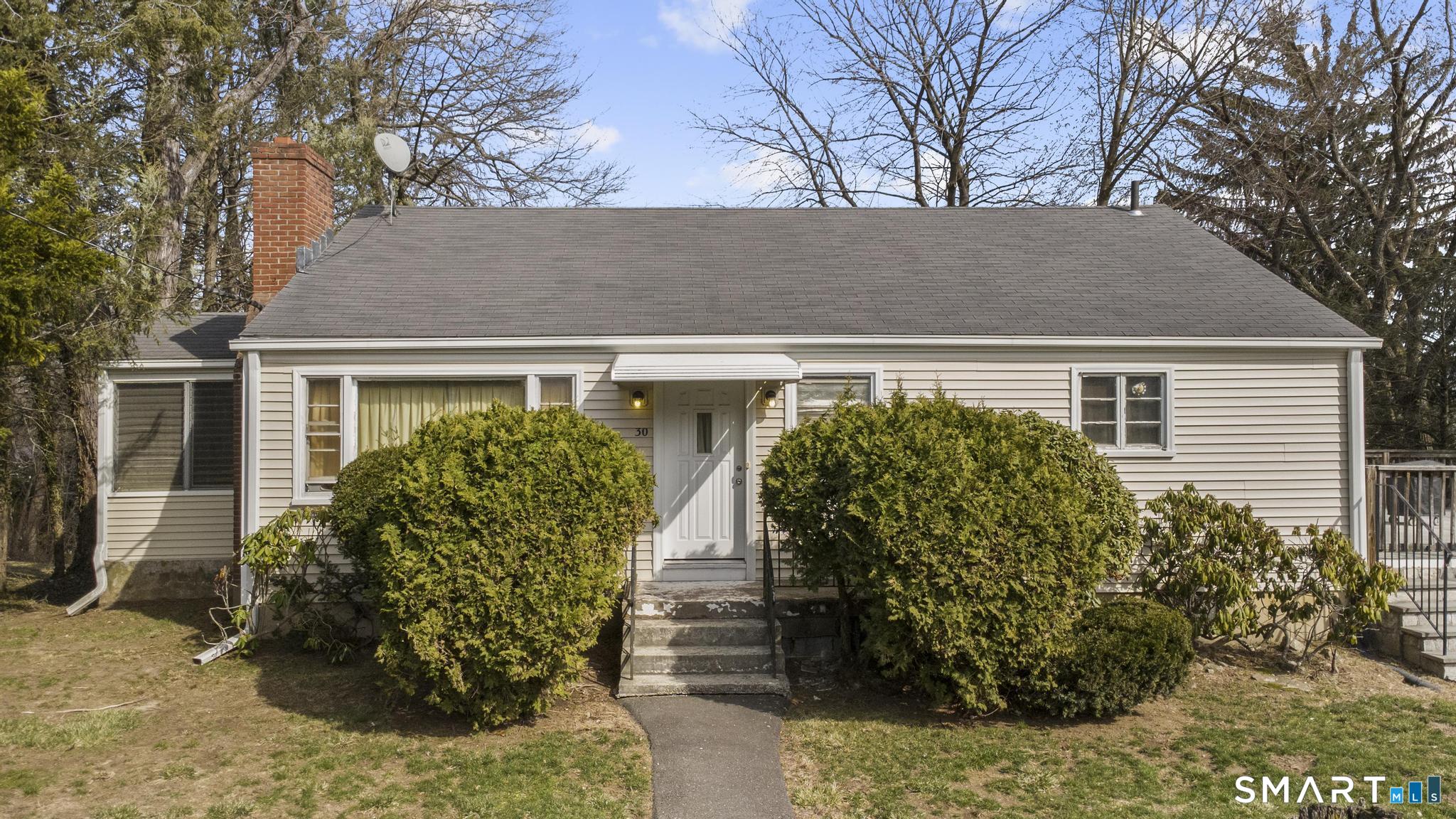 30 Parklawn Drive Waterbury, CT 06708 - Photo 4 of 22 a front view of house with yard and trees around