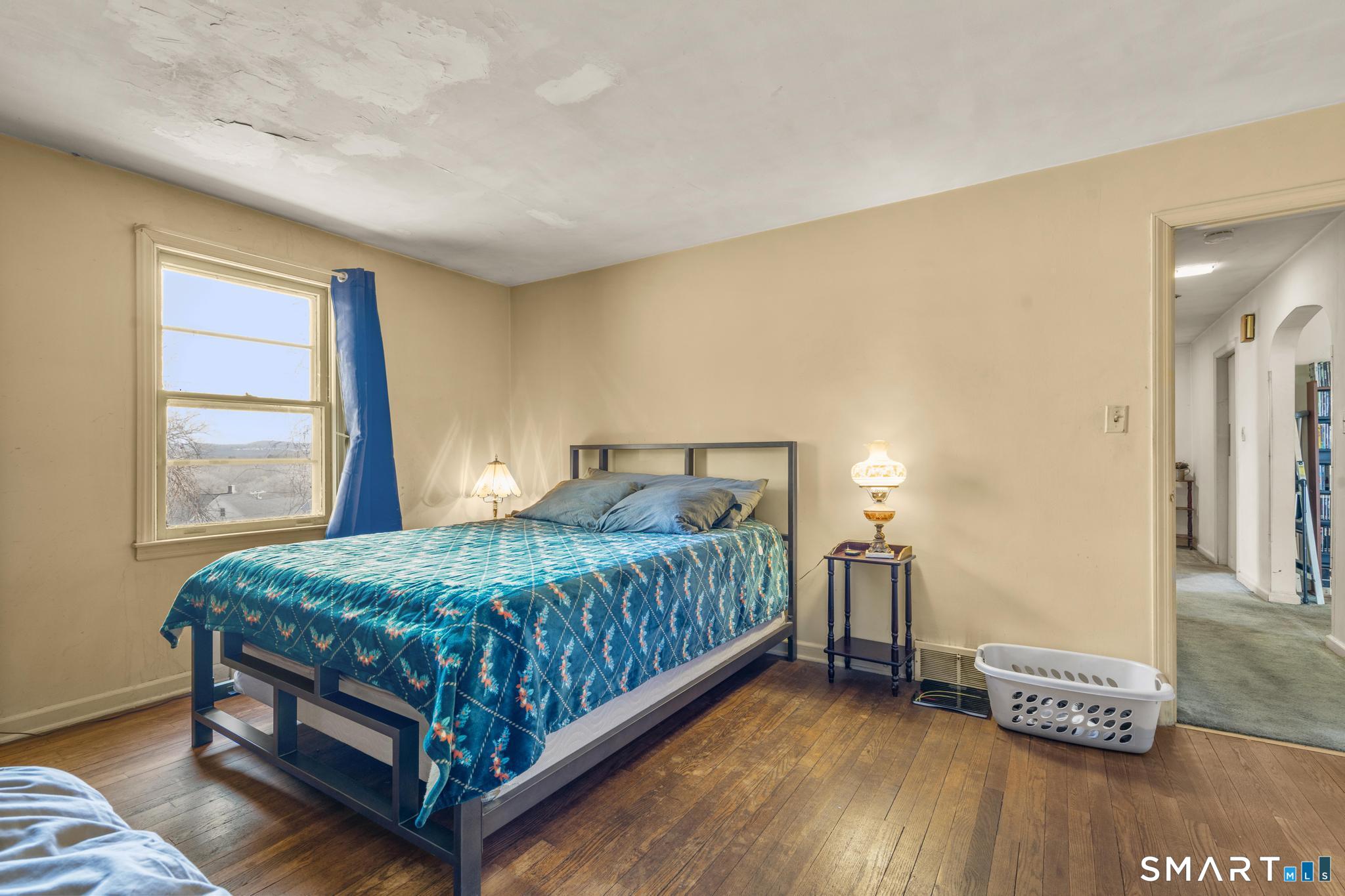 30 Parklawn Drive Waterbury, CT 06708 - Photo 9 of 22 a bedroom with a bed and a window