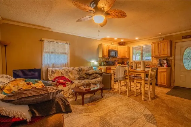 a bedroom with furniture and a chandelier