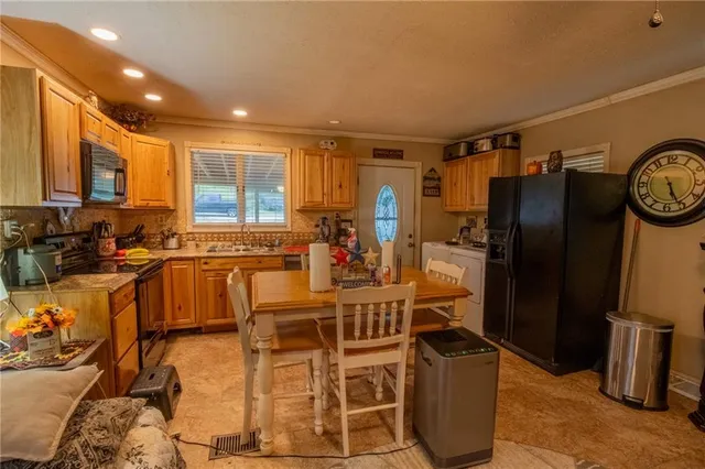 a very nice looking kitchen with a large window