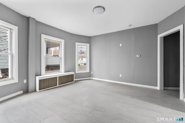a view of an empty room with a window
