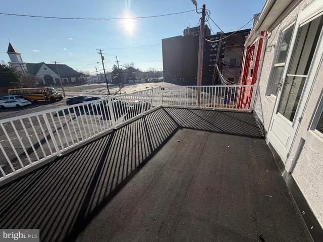 a view of balcony with wooden floor