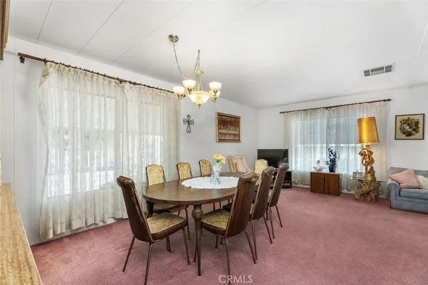 a kitchen with cabinets and window