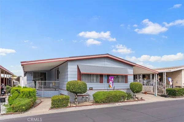 a view of house and a yard