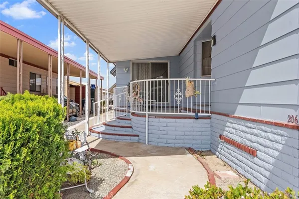 a view of a house with entrance and stairs