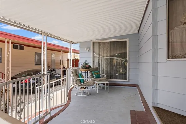 a view of a balcony with chairs